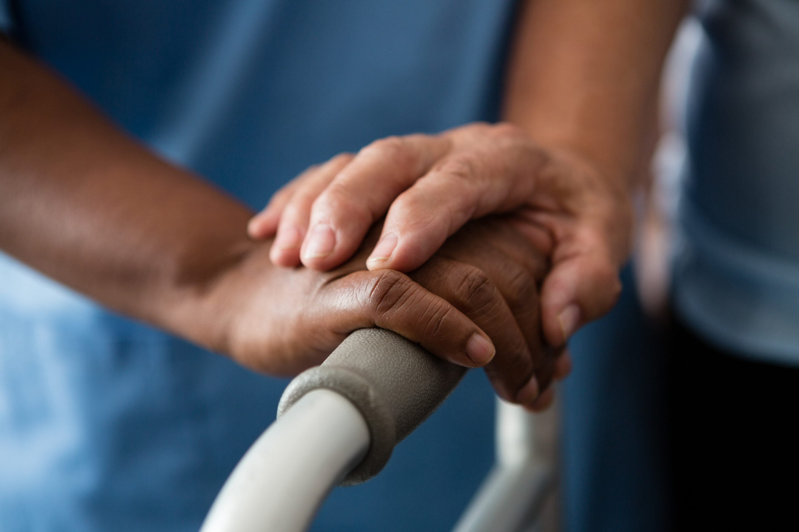 A caregiver supporting a patient while walking